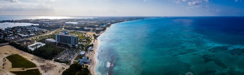 Preview: Aerial Drone Image Of Seven Mile Beach, West Bay And George Town On The Island Of Grand Cayman In