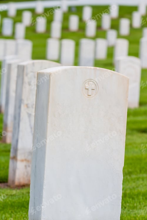 Preview: Rows Of Tombstones In A Military Graveyard With Bright Green Spring Grass