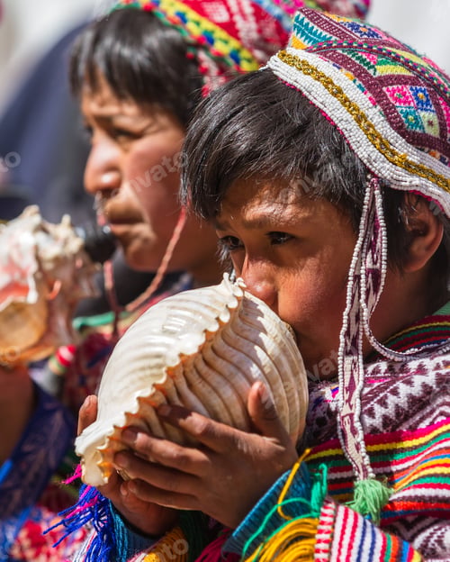 Preview: Pisac, Peru - May 15: Young Man Playing A Tune Using A Conch Shell As Part Of A Ceremony In The