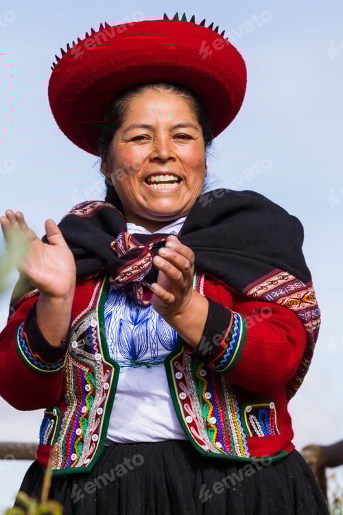 Preview: Chinchero Peru -May 18 : Native Cusquena Woman Dressed In Traditional Colorful Clothing Welcoming