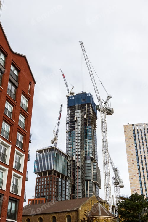 Preview: London - September 06 2019: Construction Cranes Busy At Work Erecting Tall Buildings Around The