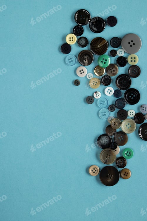 Preview: Multi Colored Clothes Sewing Buttons On Blue Background