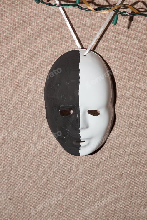 Preview: Party Mask, Painted Black And White, Hanging From Colored Lights