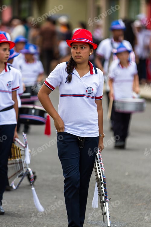 Preview: Tilaran, Costa Rica - September 15 : School Children Marching In The Town Square Playing Percussion