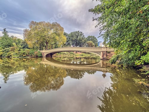 Preview: The Bow Bridge Is A Cast Iron Bridge Located In Central Park, New York City, Crossing Over The Lake