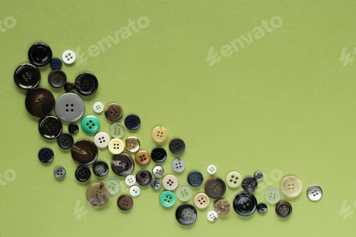 Preview: Multi Colored Clothes Sewing Buttons On Green Background