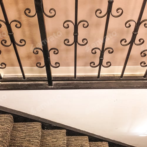 Preview: Detail Of Outdated Carpeted Stairs And Wrought Iron Railing
