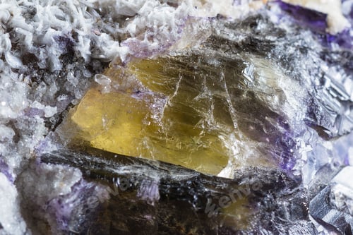 Preview: Close Up Of A Beutiful Piece Of Crystal With Dark Purples And Yellow With Clear Sections