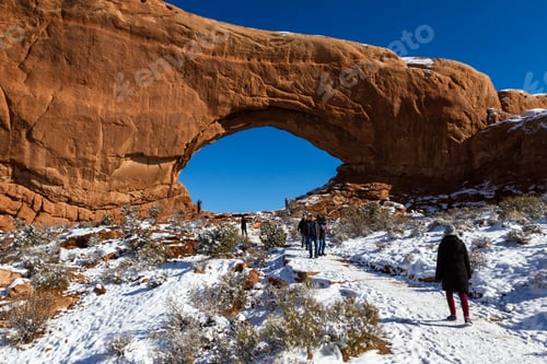 Preview: Moab, Utah - December 03: Tourists Walking In The Snow Covered Trail To See North Window Up Close