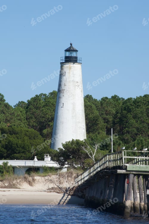 Preview: Lighthouse On The Bank With Trees Around It