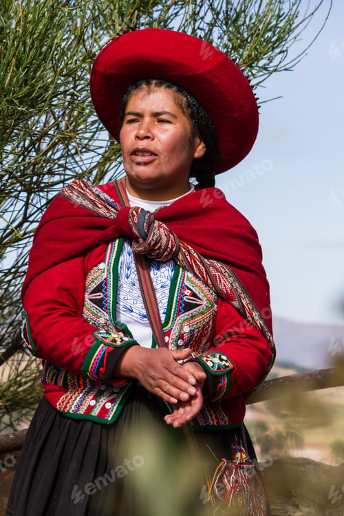 Preview: Chinchero Peru -May 18 : Native Cusquena Woman Dressed In Traditional Colorful Clothing Welcoming