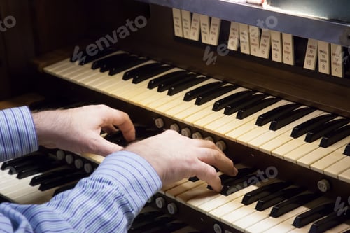 Preview: Mans Hands Playing An Organ