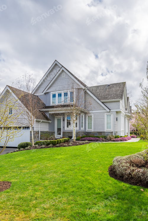 Preview: Beautiful Exterior Of Newly Built Luxury Home. Yard With Green Grass And Walkway Lead To Front