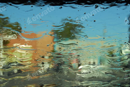 Preview: A Street And Buildings Seen Through Sheets Of Water Running Down Glass