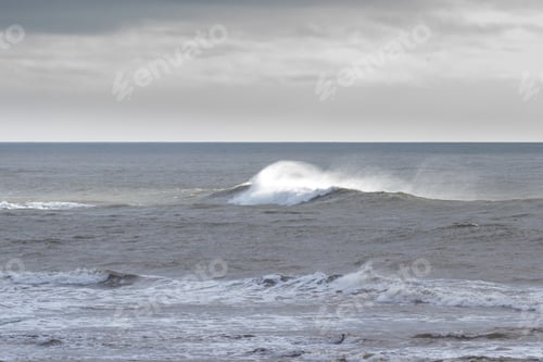 Preview: A Break In The Clouds Where A Ray Of Sunshine Lit Up The Crashing Wave