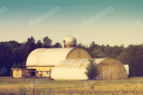 Preview: Traditional American Yellow Barn With Blue Sky