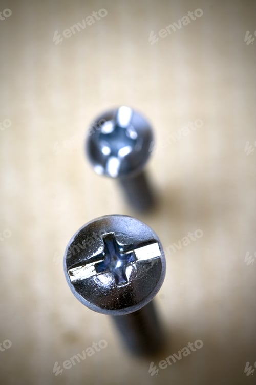 Preview: Two Screw Standing In Wood With Shallow Depth Of Field