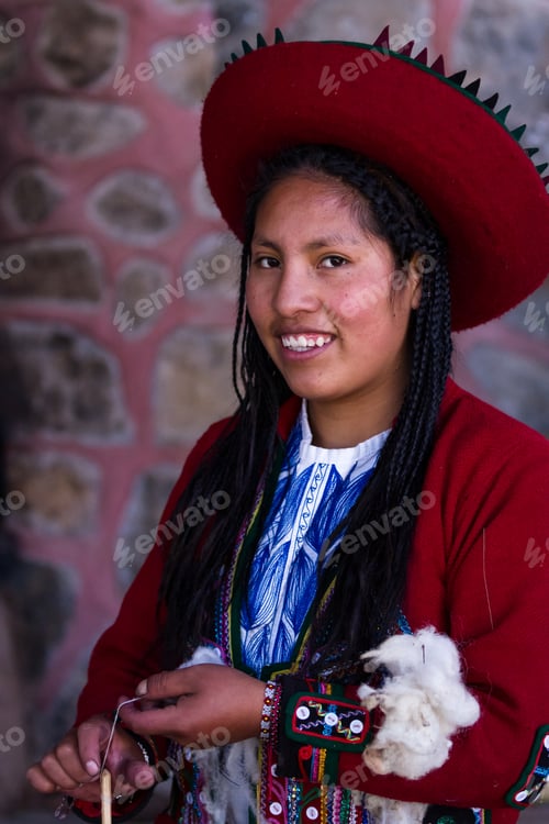Preview: Chinchero Peru -May 18 : Native Cusquena Woman Dressed In Traditional Colorful Clothing Explaining