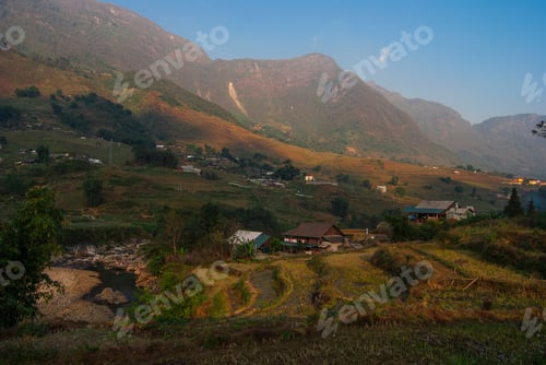 Preview: Rice Fields Terraces With Beautiful Mountains In The Background. Village At The Bottom Of The