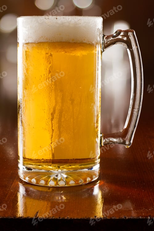 Preview: Cold Beer In A Chilled Mug Served On A Busy Bar Top