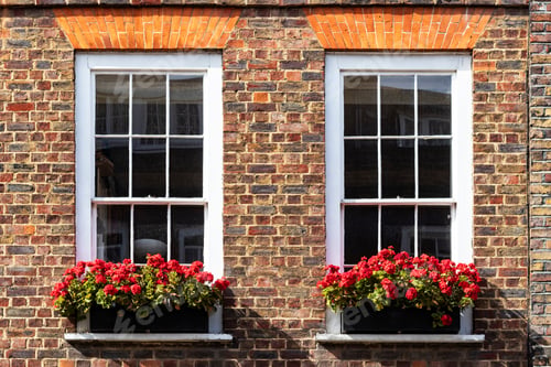 Preview: A Pair Of Old Wood Frame Windows In A Brick Wall
