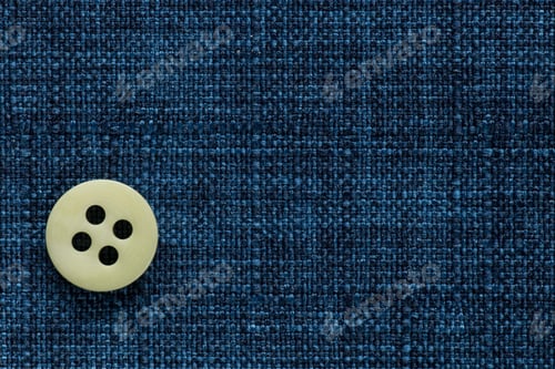 Preview: Clothes Sewing Button On A Blue Fabric Swatch Background