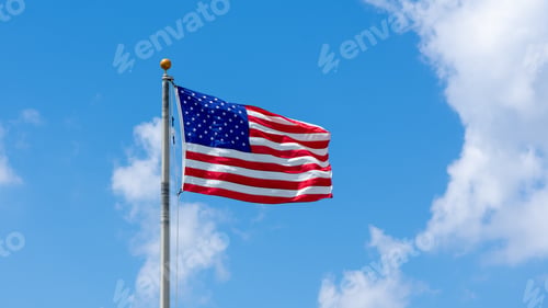 Preview: 16:9 Flag Of The United States Of America Blowing In The Wind On A Bright Blue Sky With White