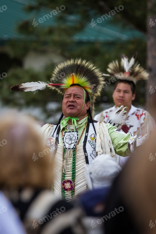 Preview: Crazy Horse Memorial, South Dakota - June 15 : Native American Performing For A Crowd In The Black