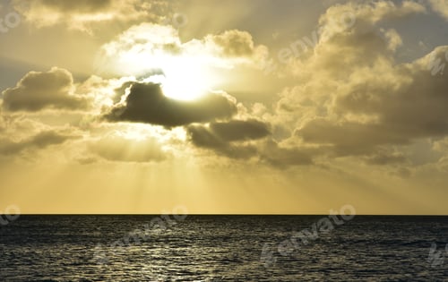 Preview: Beautiful Seascape With The Sun Behind The Clouds At Dusk.