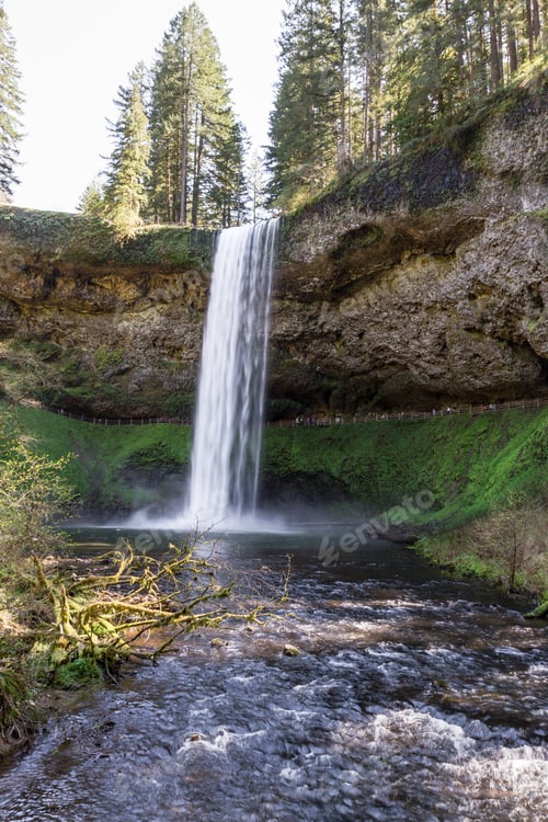Preview: Beautiful Natural Scene Of Silver Lake Falls In Oregon With Blurred People In The Path Behind Them