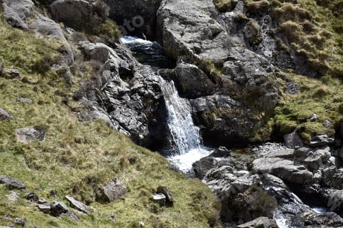 Preview: Flowing Waterfall From Spring Melt Running Down Fell.