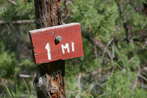 Preview: One mile Sign On A Hiking Path