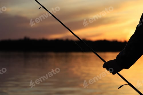 Preview: Sunset Silhouette Against A Golden Sky, As Seen On The Wild Lakes Of Canada. Fishing And Holiday