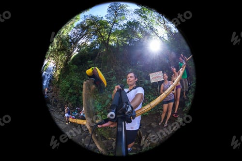Preview: Nauyaca, Costa Rica - January 28: Tourist Taking A Selfie With A Fiery Lens And A Toucan In Front
