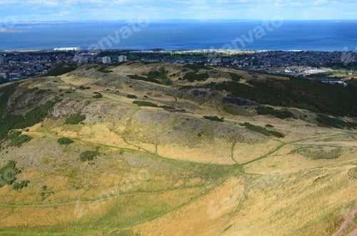 Preview: Rolling Green Hills With The City Of Edinburgh Scotland In The Background.