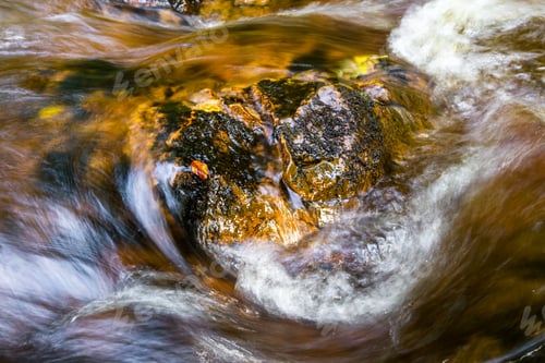 Preview: Shallow Burn Flowing With Fresh Water With A Reddish Brown Color Characteristic Of The Scottish