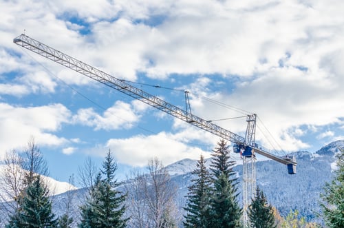 Preview: High-Rise Building Under Construction. The Site With Cranes Against Blue Sky