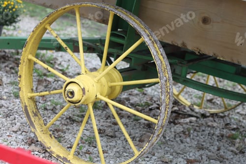 Preview: A Closeup Of A Round Yellow Wagon Wheel And Spokes. 2802