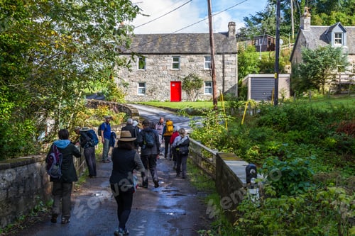 Preview: Pitlochry Scotland - September 10 2019: Group Of People Walking By The Old Post Office Identified