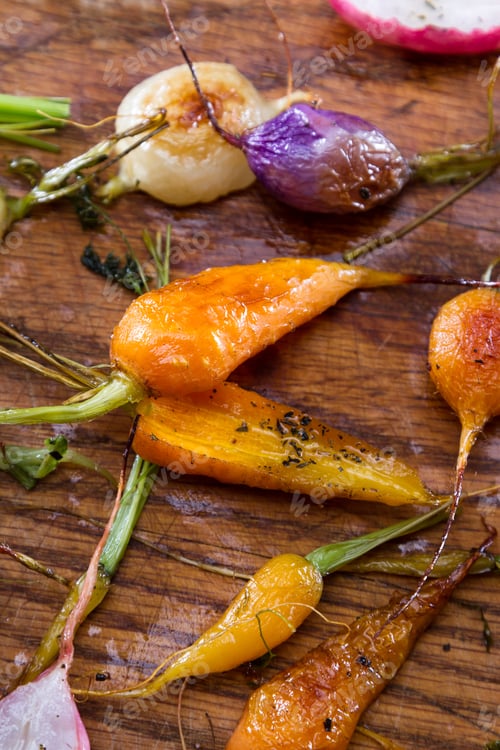 Preview: Fresh Baby Carrots And Radishes Roasted And Seasoned With Oil And Spices