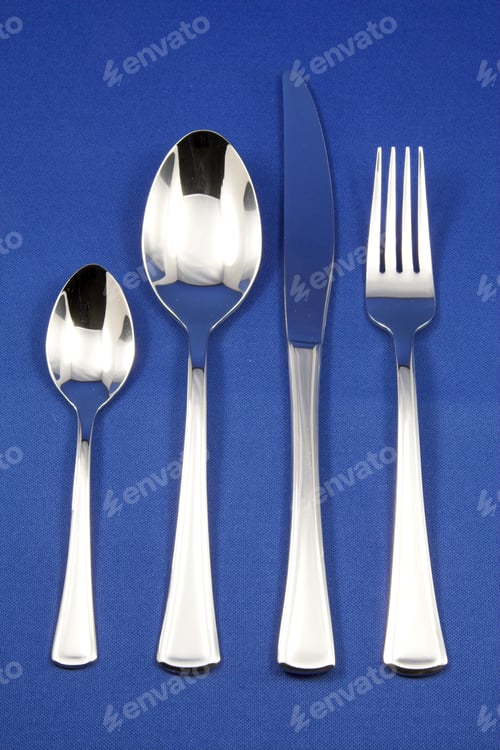 Preview: Silver Cutlery On Blue Background