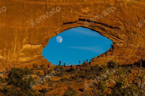 Preview: Arches Np, Utah - December 20: Tourists Enjoying The Full Moon Rising Thru North Window. December