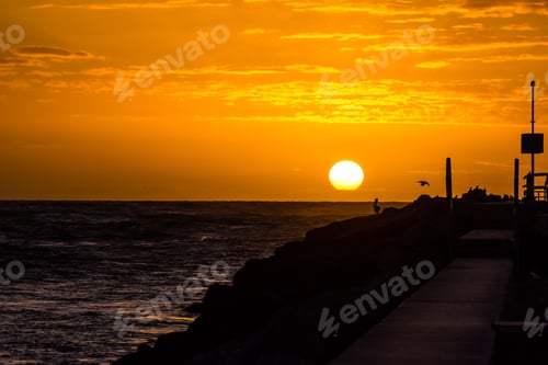 Preview: A View Of The Sun Rising Over The Ocean At The Jupiter, Fl Inlet