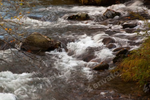 Preview: Cascades Outdoors Around Rocks In The Fall Of The Year
