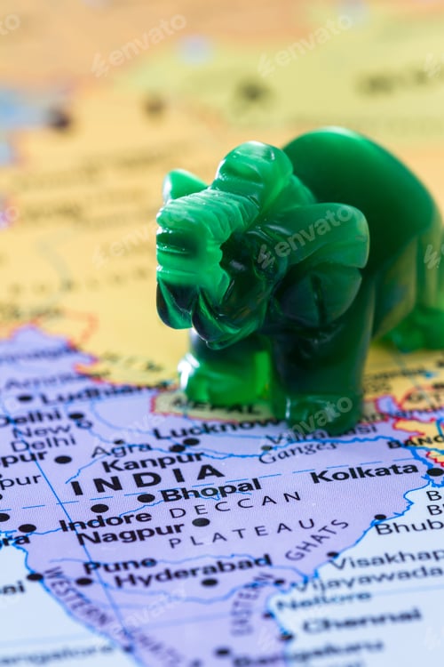 Preview: View Of A World Map With India In Focus Adn A Small Jade Elephant