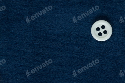 Preview: Clothes Sewing Button On A Blue Fabric Swatch Background