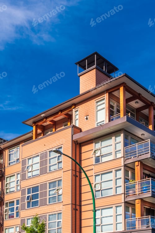 Preview: The Top Of An Apartment Building With Nice Windows.