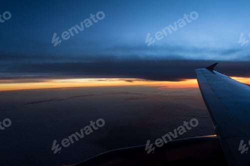 Preview: Towering Cloud Formations Viewed From An Airplane Window With Part Of The Wing In The Frame