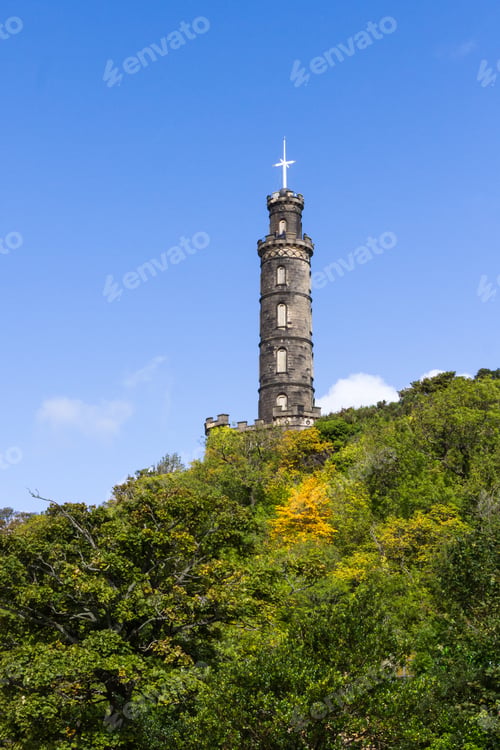 Preview: Edinburgh Scotland - September 13 2019: View Of The Nelson Monument With Green Leaves At The