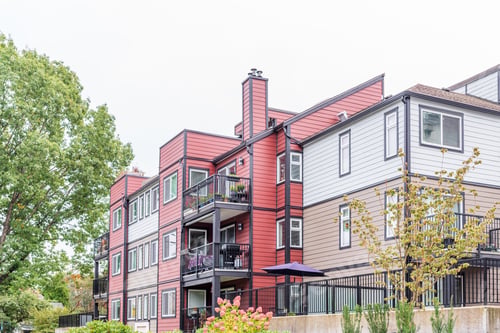 Preview: The Top Of An Apartment Building With Nice Windows.